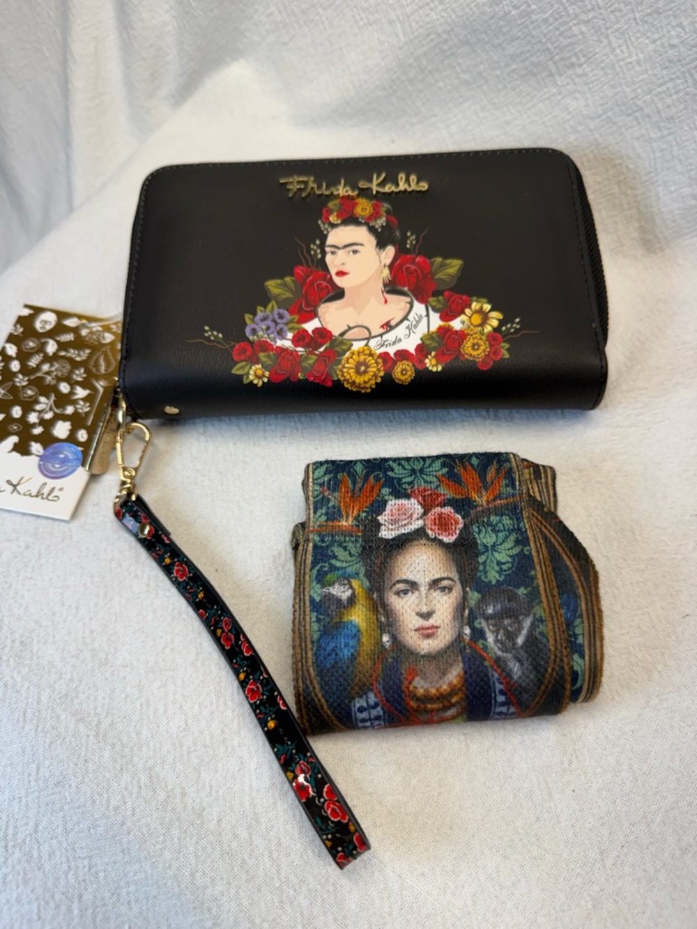 Frida Kahlo Flower Wristlet Wallet featuring faux leather & gold-tone hardware.